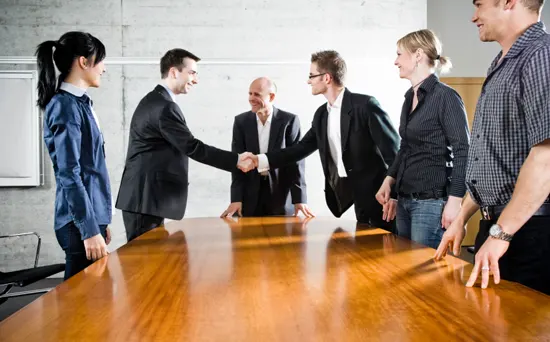 business-meeting-handshake-550x342