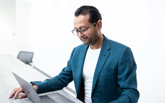 verdure-sciences-ajay-patel-sitting-at-desk-550x342